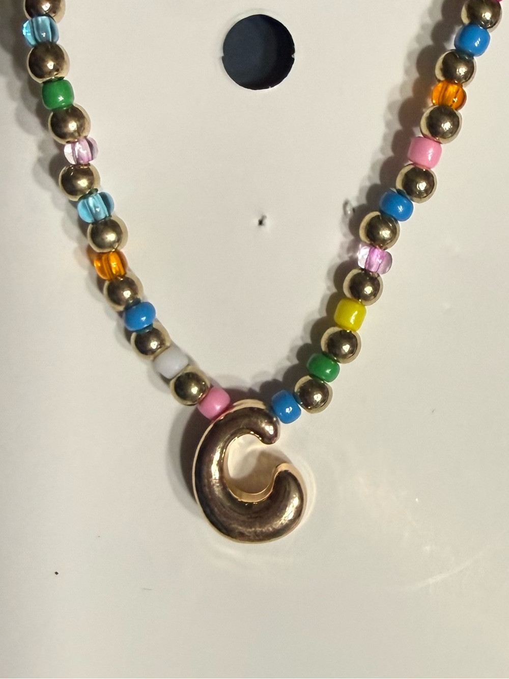 Gold-Accent Multicolor Bead Necklace with Curved Pendant $6 one each